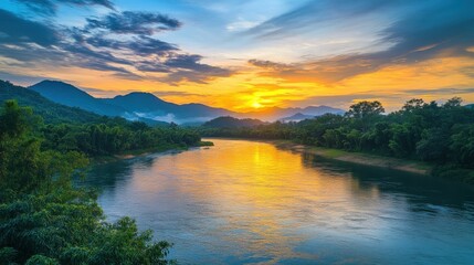 Obraz premium serene sunset over a tranquil river surrounded by mountains