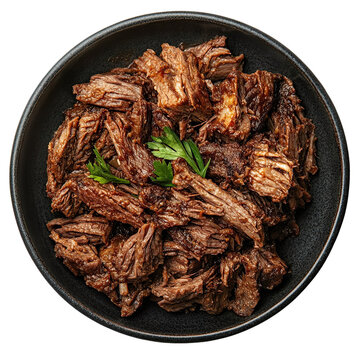 Top view of a delicious looking barbacoa on a dark ceramic plate isolated on a white transparent background