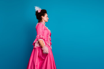 Elegant lady in a pink baroque dress against blue background, embodying 18th-century European royalty with aristocratic poise and style