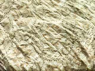 Intricate textured fabric with delicate patterns and ample copy space for design projects or presentations