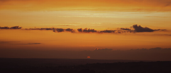 Sunset View with Orange Sky and Clouds