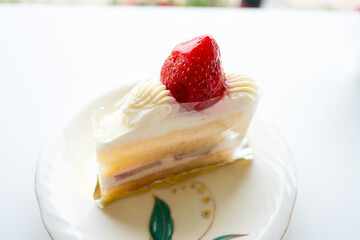 Delicious layered cake with strawberry topping