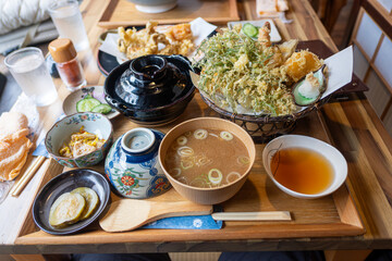 Ginzan onsen, Yamagata, Japan, Traditional Japanese meal with various dishes on a wooden table.