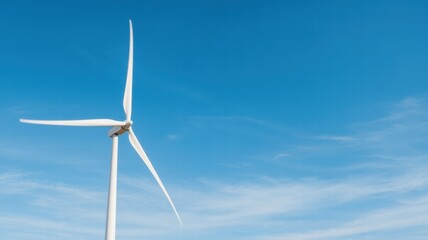 A clear blue sky featuring a tall wind turbine, symbolizing renewable energy and sustainable technology.