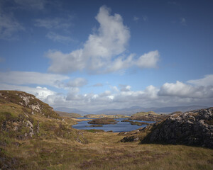 Rugged nature with scanty vegetation, hills and lakes on the Isle of Harris. Outer Hebrides of Scotland