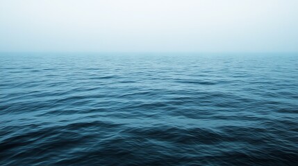 Obraz premium Serene Ocean View with Gentle Ripples and Soft Horizon in Calm Blue Tones