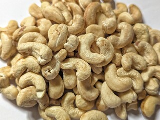 Close up photo of cashew nuts on the white background stock photo