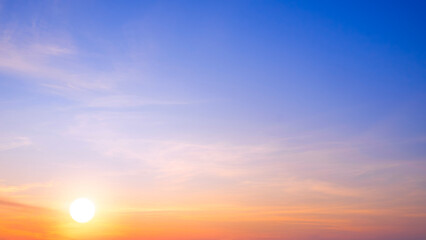 Sunrise sky background in the morning. Golden sun and yellow sunlight cloud with gradient natural light on blue summer sunset sky backdrop