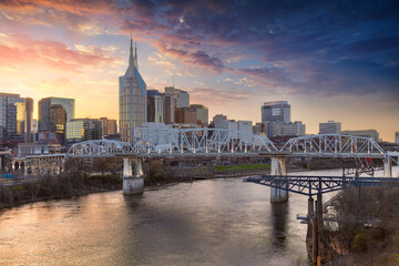Nashville, Tennessee, USA. Cityscape image of Nashville, Tennessee, USA downtown skyline with reflection of the city the Cumberland River at spring sunset.