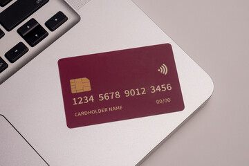 Close up of debit and credit cards placed in front of laptop. online shopping payment and retail...