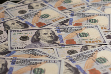 A stack of hundred-dollar bills on a white isolated background. 100 dollar bills