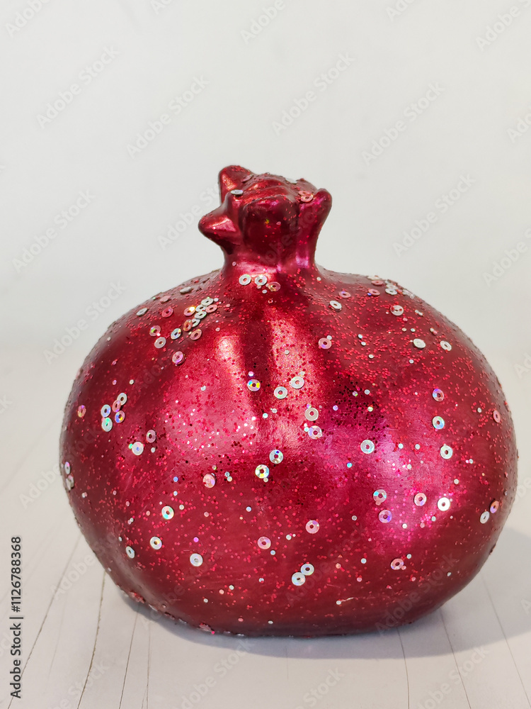 Poster a red and glittery fruit shaped object