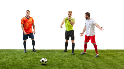 Obraz premium Soccer referee blowing a whistle and making gesture to signal foul while player prepares to take penalty, highlighting rule enforcement in game. Concept of sport, fair play, competition, control