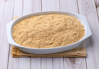 Farofa, typical brazilian manioc flour side dish over wooden table