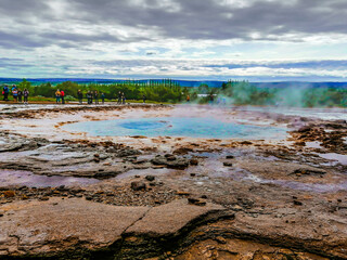 Haukadalur Valley, Iceland - Julay 11th 2019: Close view of Strokkur,  a fountain-type geyser located in a geothermal area