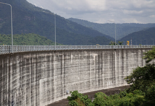 View of Khun Dan Prakan Chon Dam was formerly named Khlong Tha Dan Dam. It is the worlds largest Rolled Compacted Concrete Dam (RCC) with sky and clouds in the background at Nakhon Nayok. Copy space.
