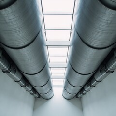 Modern industrial metal ventilation ducts within a sleek contemporary building