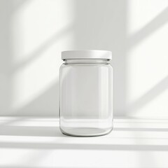 A clear glass jar with a white lid, sitting in soft light, creating a minimalist and modern aesthetic.