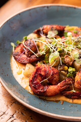 Shrimp and Grits on a Plate at a Restaurant