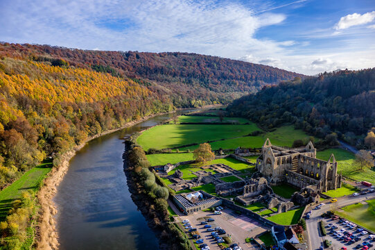 Aerial view of colourful autumn leaves and the ruins of Tintern Abbey, Wales