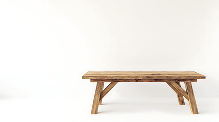 A wooden table is sitting in a room with a white wall