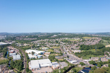 Aerial drone photo of the village of Kirkheaton in the Kirklees district in the county of West Yorkshire England showing the village and British residential housing estates in the summer