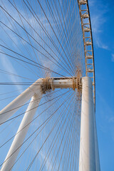 Naklejka premium Part of Ferris wheel against the backdrop of a blue sky and the Persian Gulf. Dubai