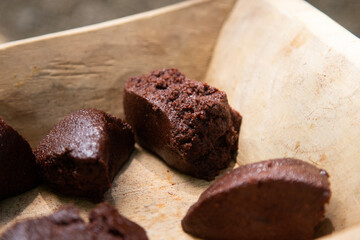 Organic chocolate from the Oaxaca region of Mexico produced in a traditional way on a metate, an ancient stone tool for grinding products.