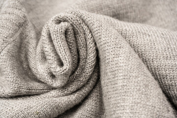 Grey wool sweater texture as a background.