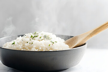 Hot cooked rice in bowl on white background. Cooked rice with steam