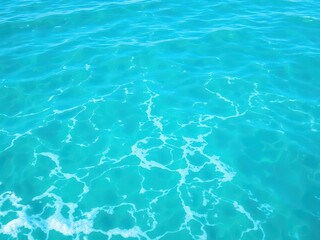 Obraz premium Pure blue turquoise water texture of the ocean sea with foam from and waves, water, tranquil