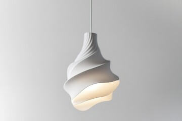 A white light fixture with a spiral shape