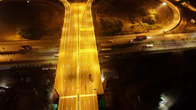 Well lit expressway intersecting at night