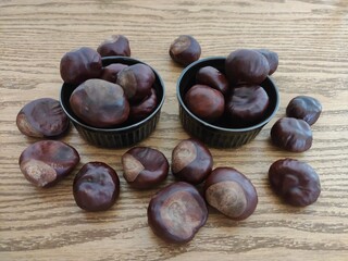 Shiny brown chestnuts on the table