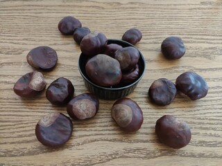 Shiny brown chestnuts on the table