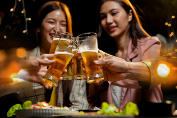 food and drink male friends are happy drinking beer and clinking glasses at a bar or pub.