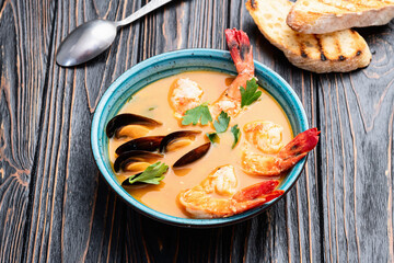 French seafood bouillabaisse soup with shrimps and mussels photography . Top view
