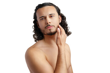 Young man with curly hair thoughtfully posing against a plain background