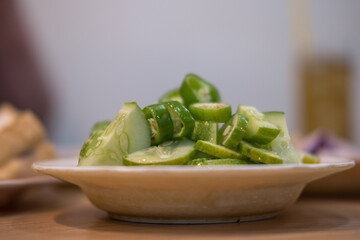 Ajad, or a side dish to eat with pork stew, is made from sliced cucumbers. Sugar simmered with vinegar Add chopped bell pepper and onion.