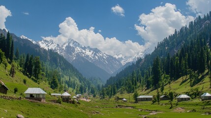A picturesque valley with mountains and traditional houses under a blue sky.