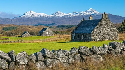 Scenic view of stone houses with mountains in the background under a clear blue sky.