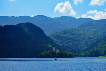 BLED, SLOVENIA -22 JUNE 2024- Landscape view of Lake Bled in summer. Bled is a lake in the Julian Alps of the Upper Carniolan region of northwestern Slovenia with a castle on an island.