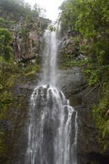 The stunning big wateralls running over the black lava rocks on Maui Island in Hawaii