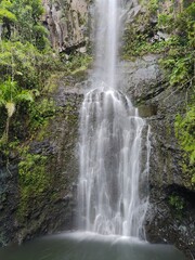 The stunning big wateralls running over the black lava rocks on Maui Island in Hawaii