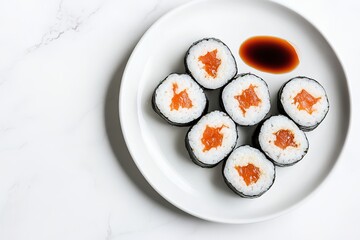 Sushi rolls on plate with soy sauce, minimal design