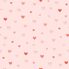 Vector illustration. Seamless pattern of cute red hearts on pink background. Valentine's Day design for fabric, wallpaper, textile, wrapping paper, delicate children's background, website banner
