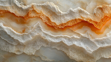 Textured layers of natural stone show beautiful shades of orange and white, resembling waves in a fluid formation indicative of geological processes