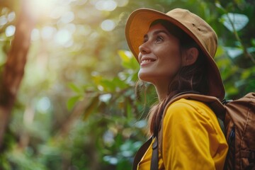 Joyful woman hiking in the wilderness, exploring nature with a backpack and outdoor gear during a forest adventure
