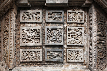 Dancing people, and indian lords on wall of abandoned temple, India.  