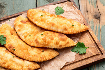 Snack chebureks. Pasties with meat photography . Top view
